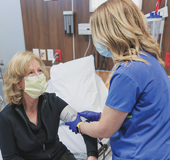 woman getting blood pressure taken